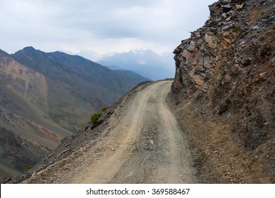 Dangerous Steep And Shallow Unpaved Road In Mountains