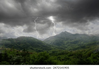 Dangerous thuderbolt and lightnings over the mountains in monsoon season in Asia - Powered by Shutterstock