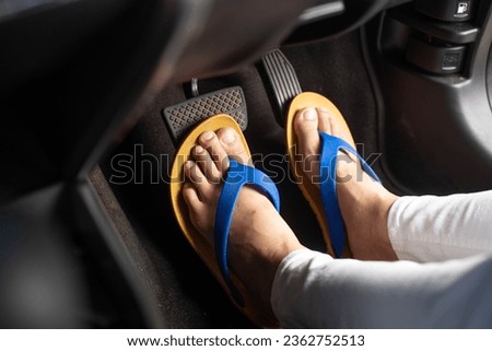 The Dangers of Wearing Sandals While Driving, young woman wearing sandals while driving, breaking the law, car accident, carelessness while driving