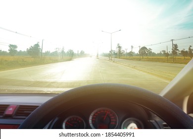 Dangers While Driving On The Road When There Is Light Reflecting The Sun On The Front Of The Car Makes The Road View Unclear.Road Safety Concept