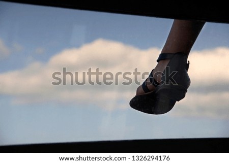 Similar – bare foot at the window