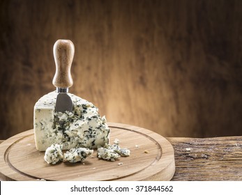 Danish blue cheese on a wooden board.