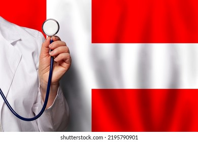 Danish Medical Worker's Hand With Stethoscope On Flag Of Denmark Background