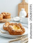 Danish pastry on a white plate. with icing sugar. Perfect for recipe, article, photo illustration, or any commercial purpose.