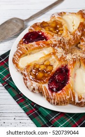 Danish Pastry Ring With Cherry, Apple Fruit And Cheese Fillings. Selective Focus.