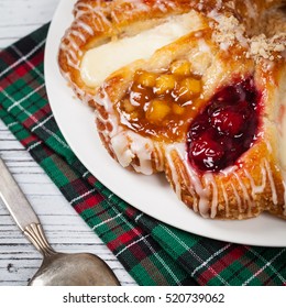 Danish Pastry Ring With Cherry, Apple Fruit And Cheese Fillings. Selective Focus.