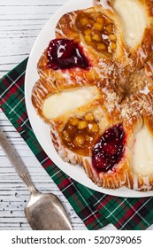 Danish Pastry Ring With Cherry, Apple Fruit And Cheese Fillings. Selective Focus.