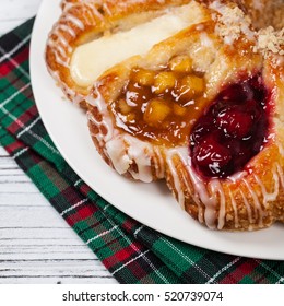 Danish Pastry Ring With Cherry, Apple Fruit And Cheese Fillings. Selective Focus.