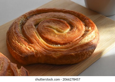 Danish Pastry Swirls On A Bamboo Chopping Board. 