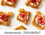 Danish puff pastry with cream and berries on a white background