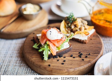 Danish Smorrebrod Sandwich With Salmon Fish And Egg On Wooden Board. Restaurant Food