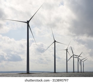 Danish Windmills. Denmark Is Famous For Its Use Of The Alternative Source Of Energy Of Wind. Windmills Are Seen All Over Denmark, In The Fields, Towns And On The Water.