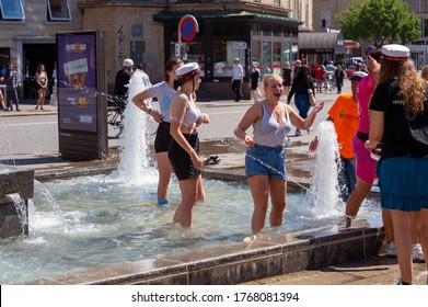 Dansih High School Students Playing In A Fountain Celebrating Graduation In Aarhus, Denmark On 25 June 2020