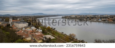 The Danube river , the border between Hungary and Slovakia, as seen from the Hungarian side, in Esztergom. The Maria Valeria bridge connects the two countries.