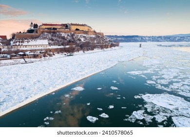 Danube river covered in snow and ice winter time  Novi Sad, Serbia Petrovaradin fortress