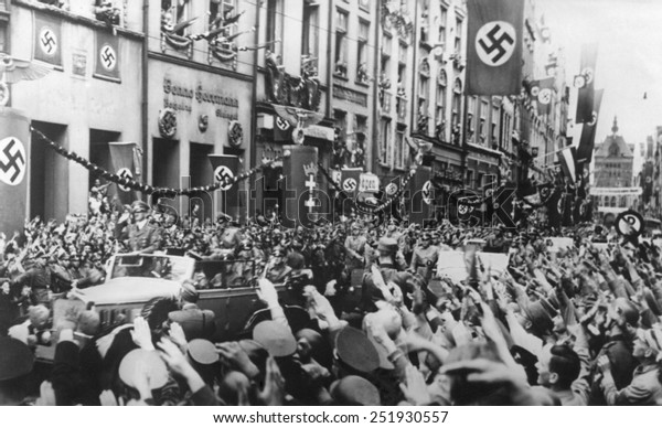 Danzig (Gdansk) greets the Fuhrer on Sept. 19, 1939. German Chancellor, Adolf Hitler receives Nazi Salutes as his rides in victory through Danzig.
