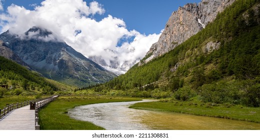 Daocheng Yading Scenery- S Shape River And Mountains Covered With Clouds. The Scenic Spot Is Located In Daocheng, Sichuan, China. Panorama