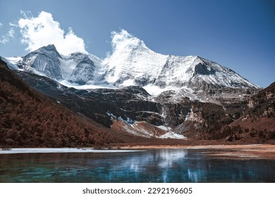 Daocheng yading scenic spot(inagi aden),in Sichuan,China National Nature Reserve,whit Blue lake, snow mountain valley, Tibetan temple.