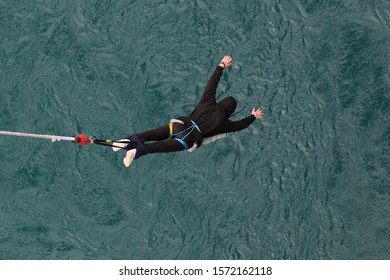 Dare Devil Bungee Jumping Over Freezing Cold River