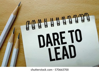 Dare To Lead Text Written On A Notebook With Pencils