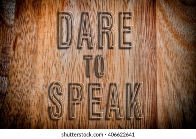 Dare To Speak Words Written On Wooden Background. Vintage And Vignette Effect Applied.