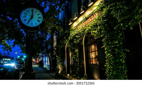 DARIEN, CT, USA - OCTOBER 2, 2021:  The Goose Bistro facade with sign and clock near Post Road with evening lights