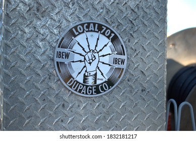 Darien, Illinois, USA. October 8, 2020. The Emblem Of The Local 701, IBEW Union Of DuPage County, Illinois, On An Electric Utility Truck.