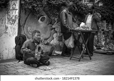 Darjeeling India June 2019: A local musician performing in a street market to earn his livelihood.