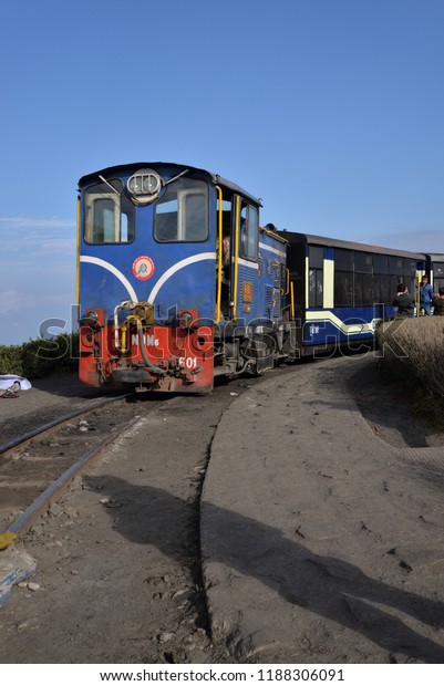 Darjeeling, West\
Bengal / India - December 9 2014: Darjeeling Himalayan Railways\
train with diesel engine. \
