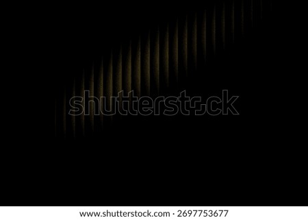 A dark, abstract background features a diagonal band of numerous thin, vertical golden-brown light streaks, creating a dynamic and textured visual effect.