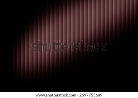 A dark, abstract image with vertical lines and a gradient effect, creating a sense of depth and texture.