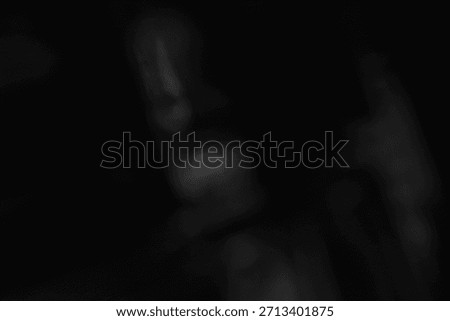 Dark abstract scene with soft reflective shapes