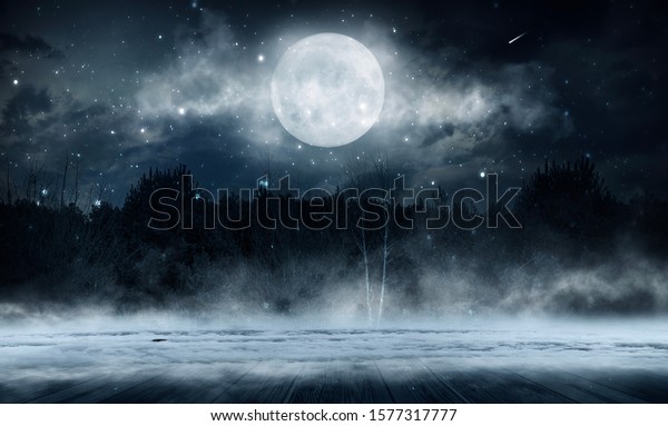 Dark abstract winter forest background. Wooden\
floor, snow, fog. Dark night background in the forest with\
moonlight. Night view,\
magic