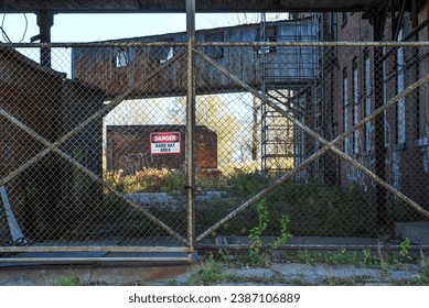 Dark Alley Fenced and Locked of Abandoned Business - Powered by Shutterstock