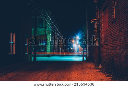 Dark alley and light trails in Hanover, Pennsylvania at night.