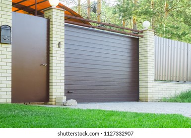 Dark automatic gates to the garage
