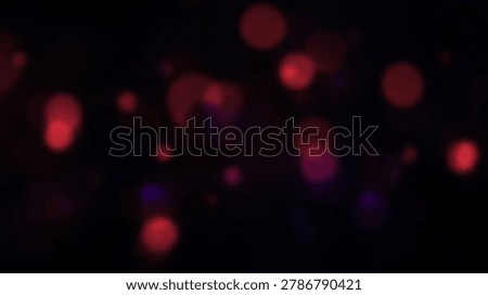 A dark background with abstract red bokeh lights, perfect for artistic designs, backgrounds, and creative projects. The blurred lights create a visually appealing effect.
