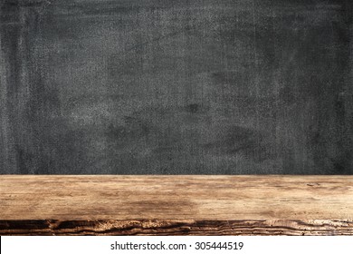 Dark Background Of Black Board And Dark Brown Shabby Desk Top 