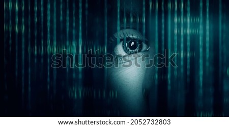 dark background with computer binary code and  hidden face watching
