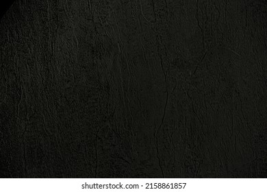 Dark background of decorative plaster with abstract spots. Unusual black or gray wall texture with beautiful patterns, creative surface background. Finishing coating for building cladding. - Shutterstock ID 2158861857
