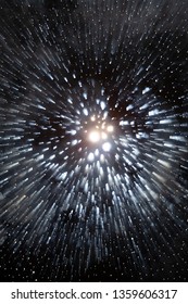 dark background of lights shaped as a explosion of stars with smoke mist and traces of light speed like a time jump on science fiction movie or a super nova explosion