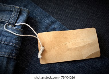 Dark background with paper jeans label/Jeans label