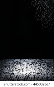 Dark background shot of rain falling