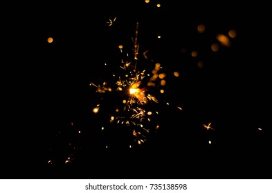 Dark background with sparkler 