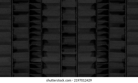 A Dark Background Of Thick Corrugated Cardboard Sheets From A Side View 