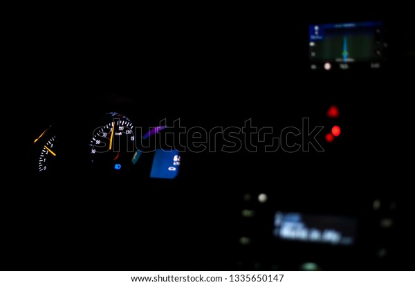 dark\
background view car dashboard lights up in the\
dark