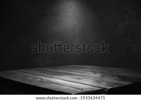 dark background wall with empty table, for montage of product