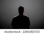 dark backlight shadow silhouette of male person, incognito unknown profile