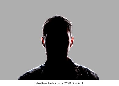 dark backlight shadow silhouette of male person, incognito unknown profile - Powered by Shutterstock