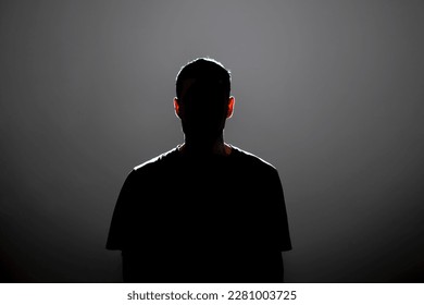 dark backlight shadow silhouette of male person, incognito unknown profile - Shutterstock ID 2281003725